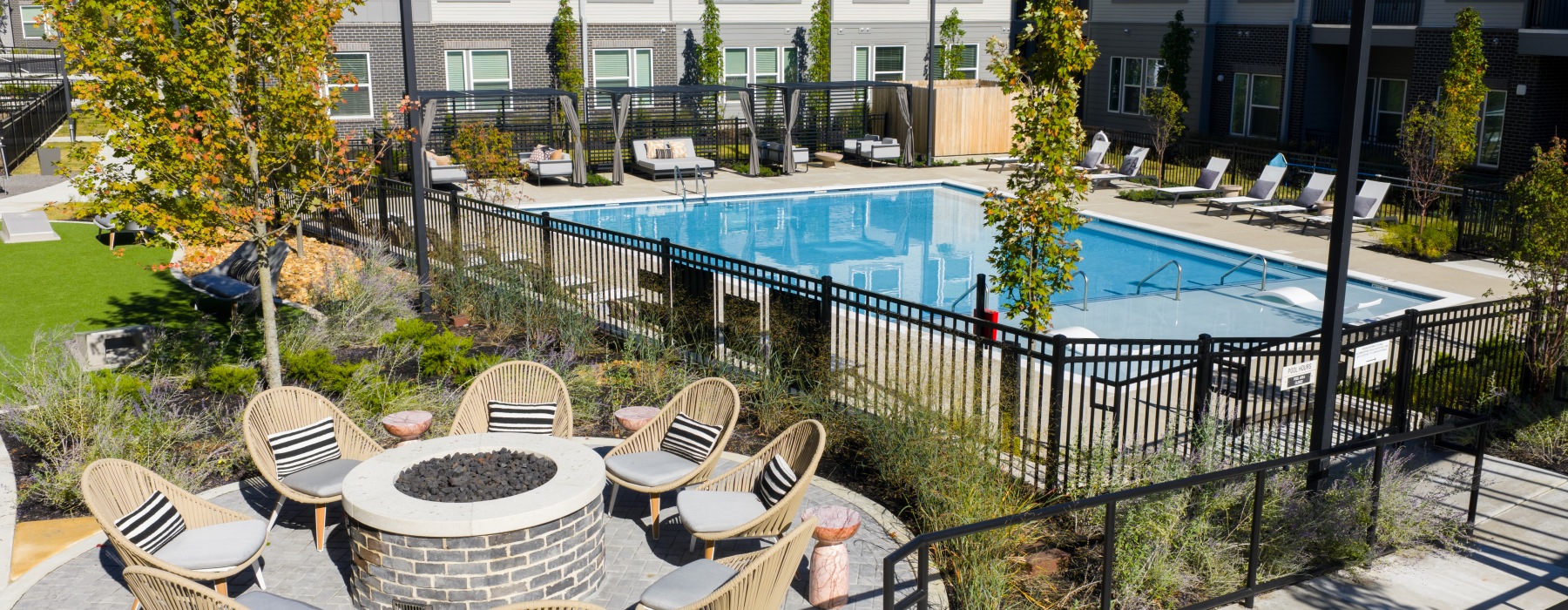 view of resort style pool and firepit at apartments in Madison, TN