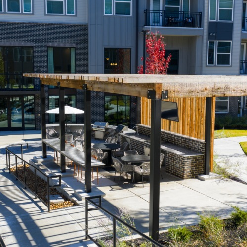Poolside cabana lounge with outdoor TV