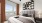 Spacious bedrooms with wood-inspired plank flooring